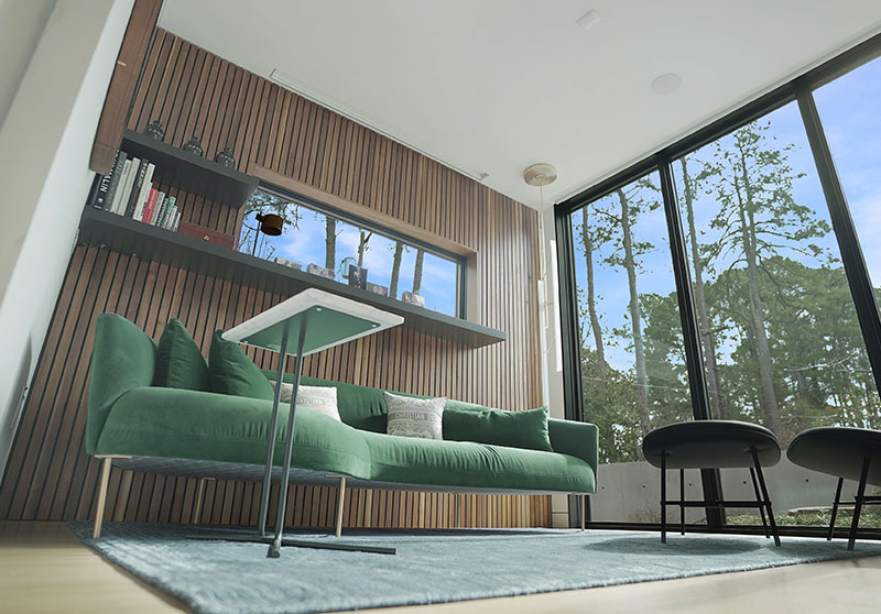 linear wood wall panels in lounge area