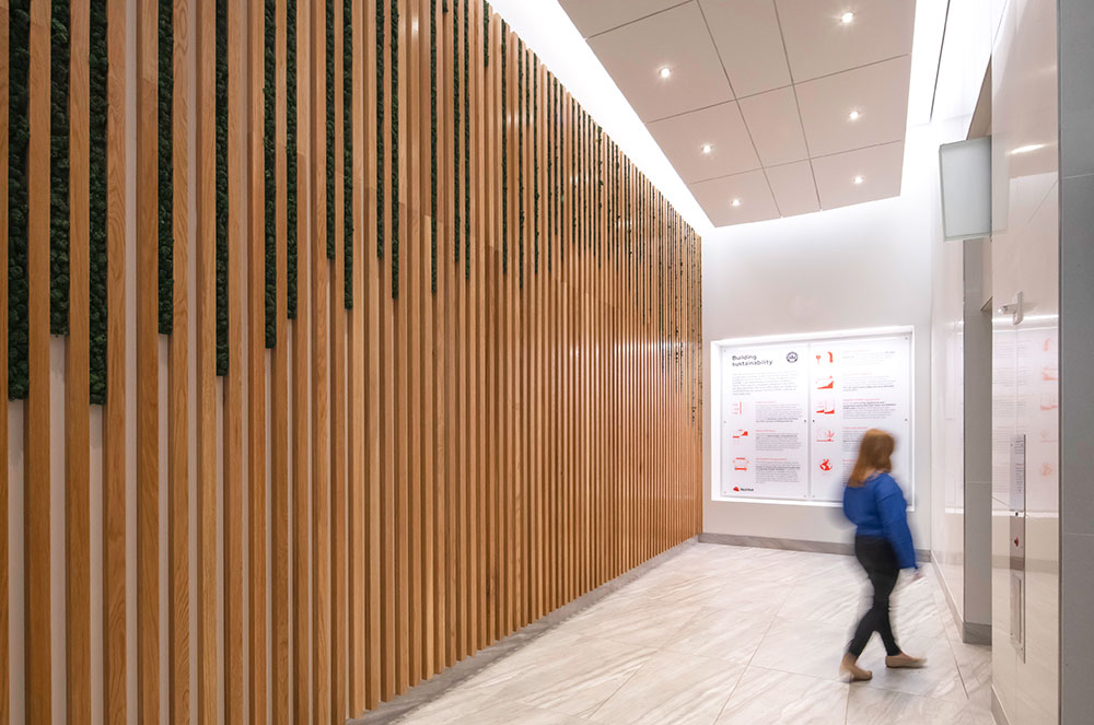 linear wood wall panels in lobby