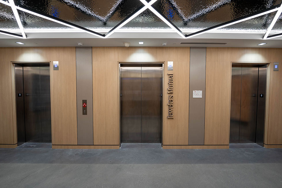 Wood wall panels next surrounding elevators