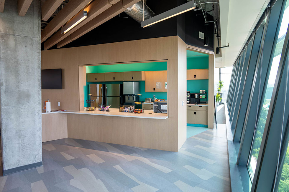 wood panel wall in office kitchen space